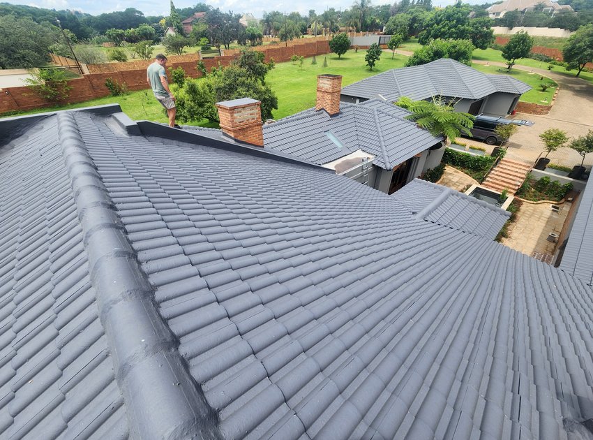 BloemGuard applicator sealing a tiled roof in Bloemfontein